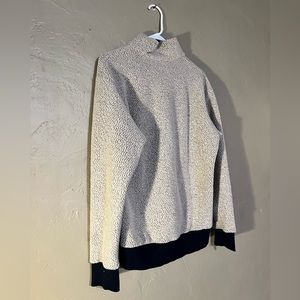 Patagonia. Size Med. Cream and Dark Blue.
